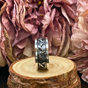 Ring med oxiderad fläta